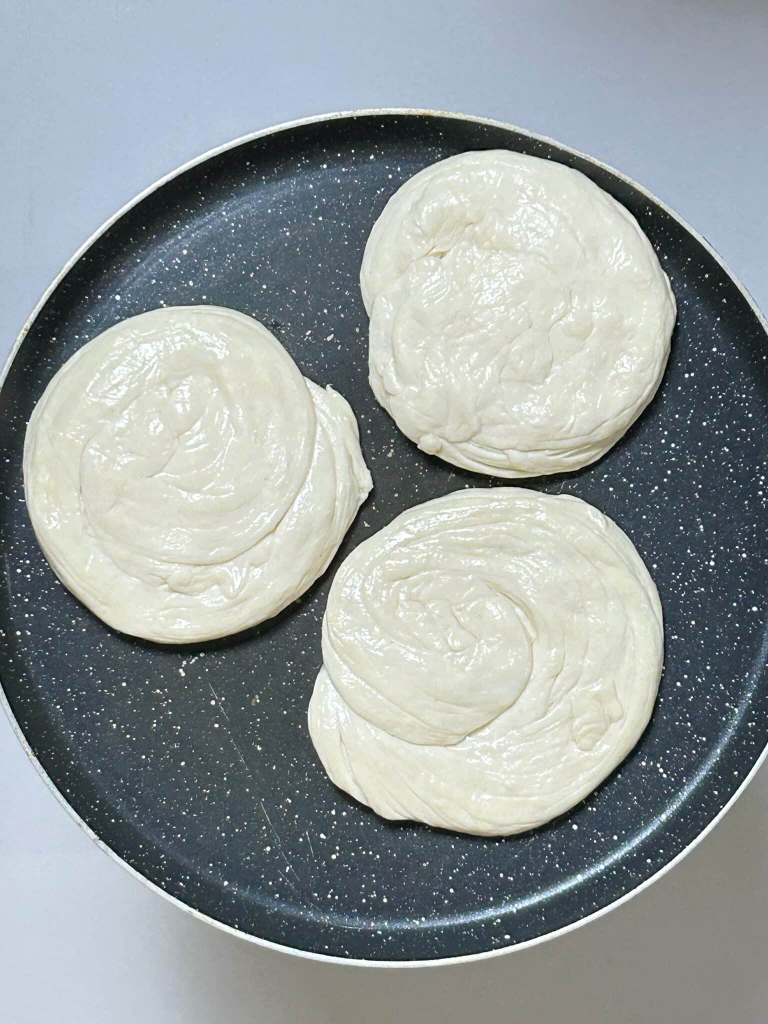 frying burger patties in a skillet