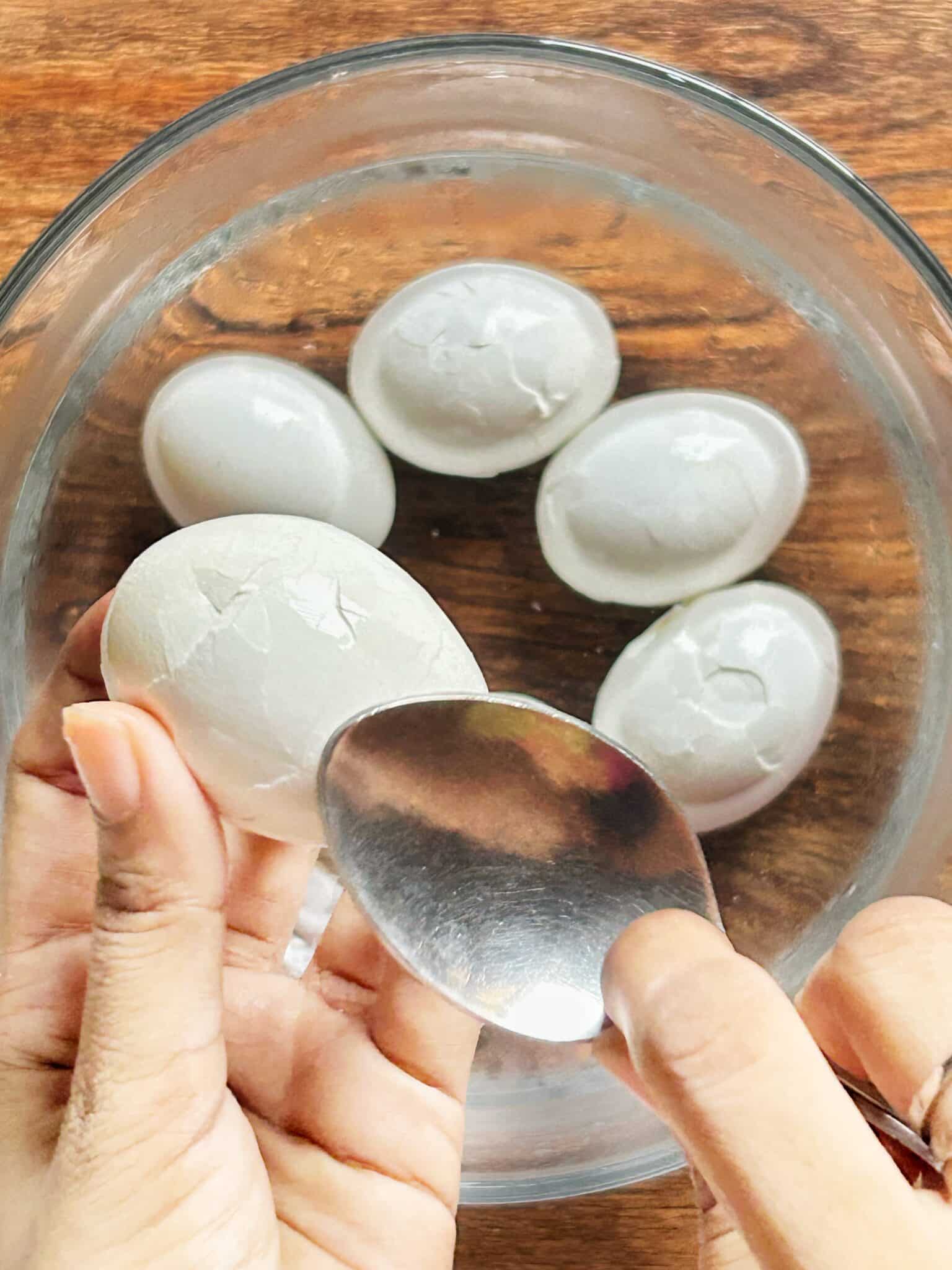 Cracked boiled eggs in an ice bath for marbled effect Cracked boiled eggs in an ice bath for marbled effect