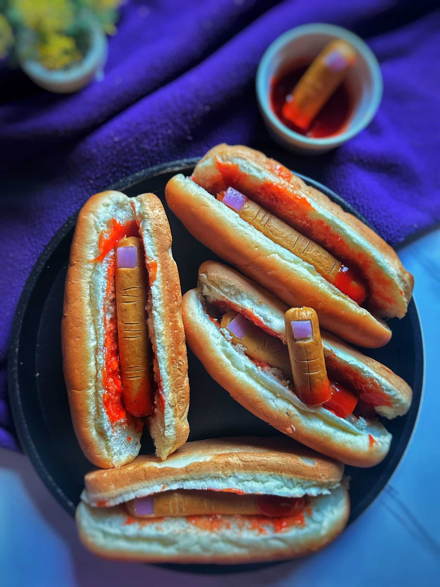 Hot dog fingers with ketchup at the base to look like dripping blood Hot dog fingers with ketchup at the base to look like dripping blood