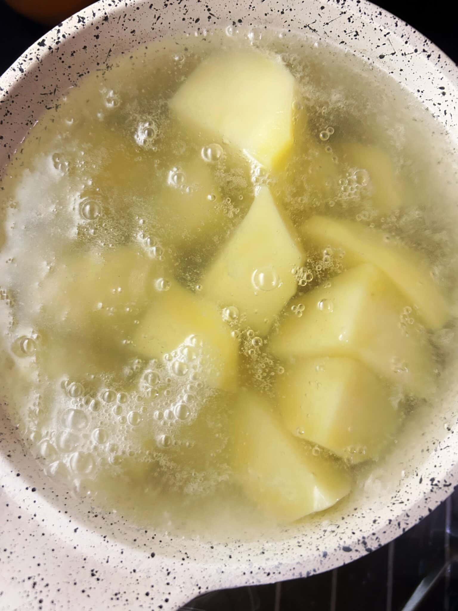 Boiling potatoes in salted water Boiling potatoes in salted water