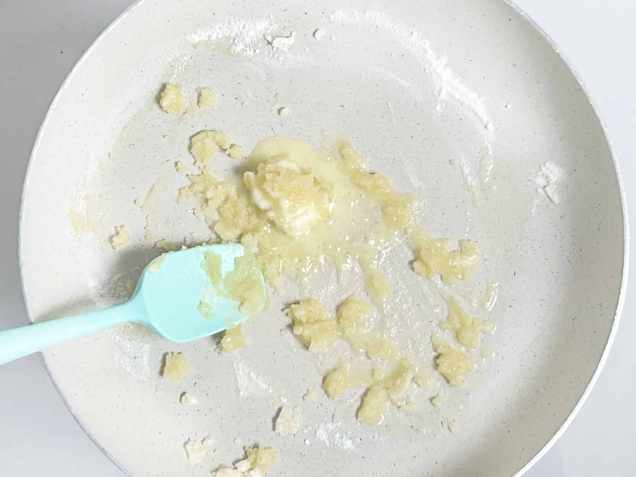 Adding butter and flour to a pan Adding butter and flour to a pan