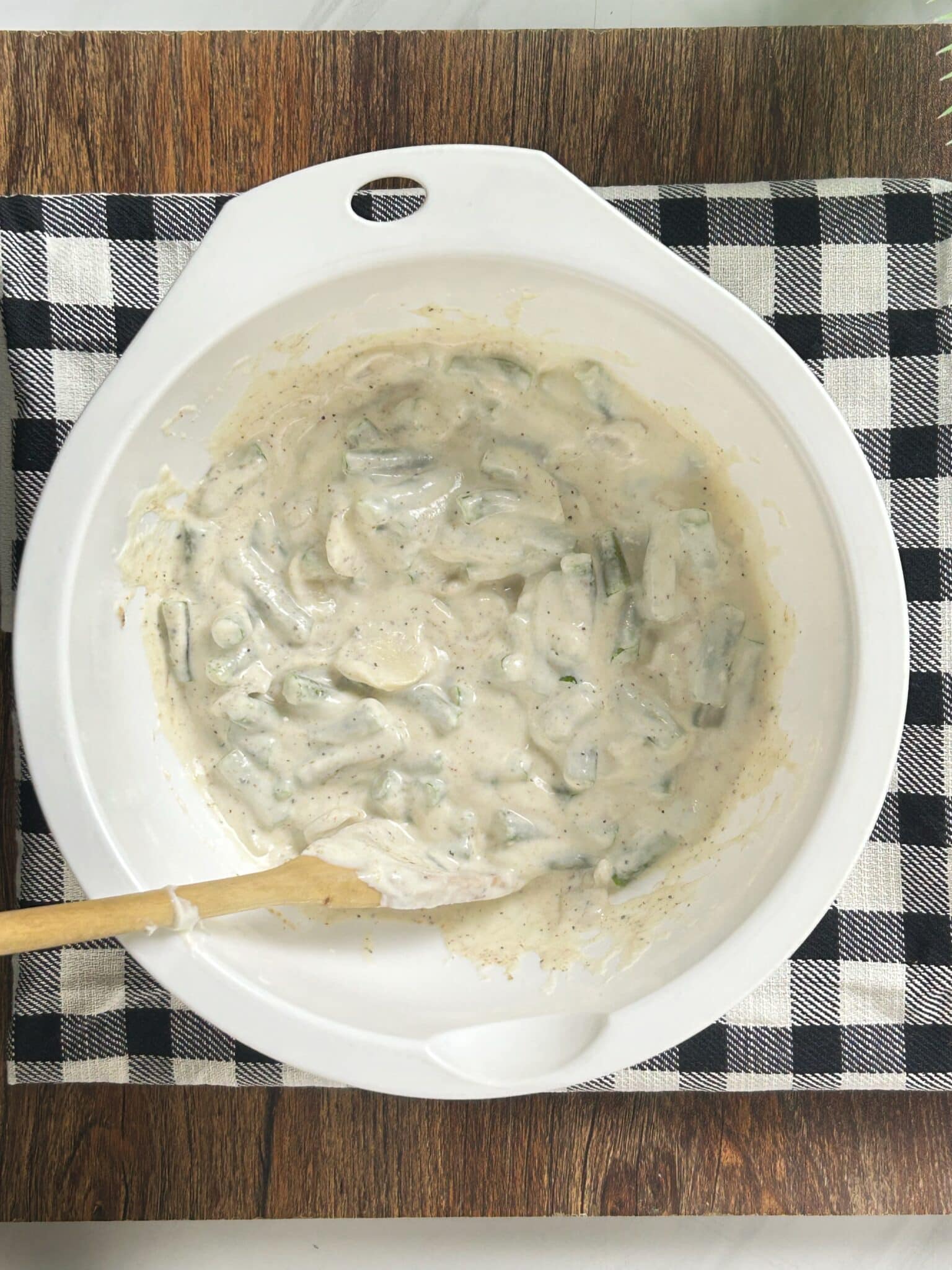 Mixing all Green Bean Casserole ingredients together in a bowl Mixing all Green Bean Casserole ingredients together in a bowl