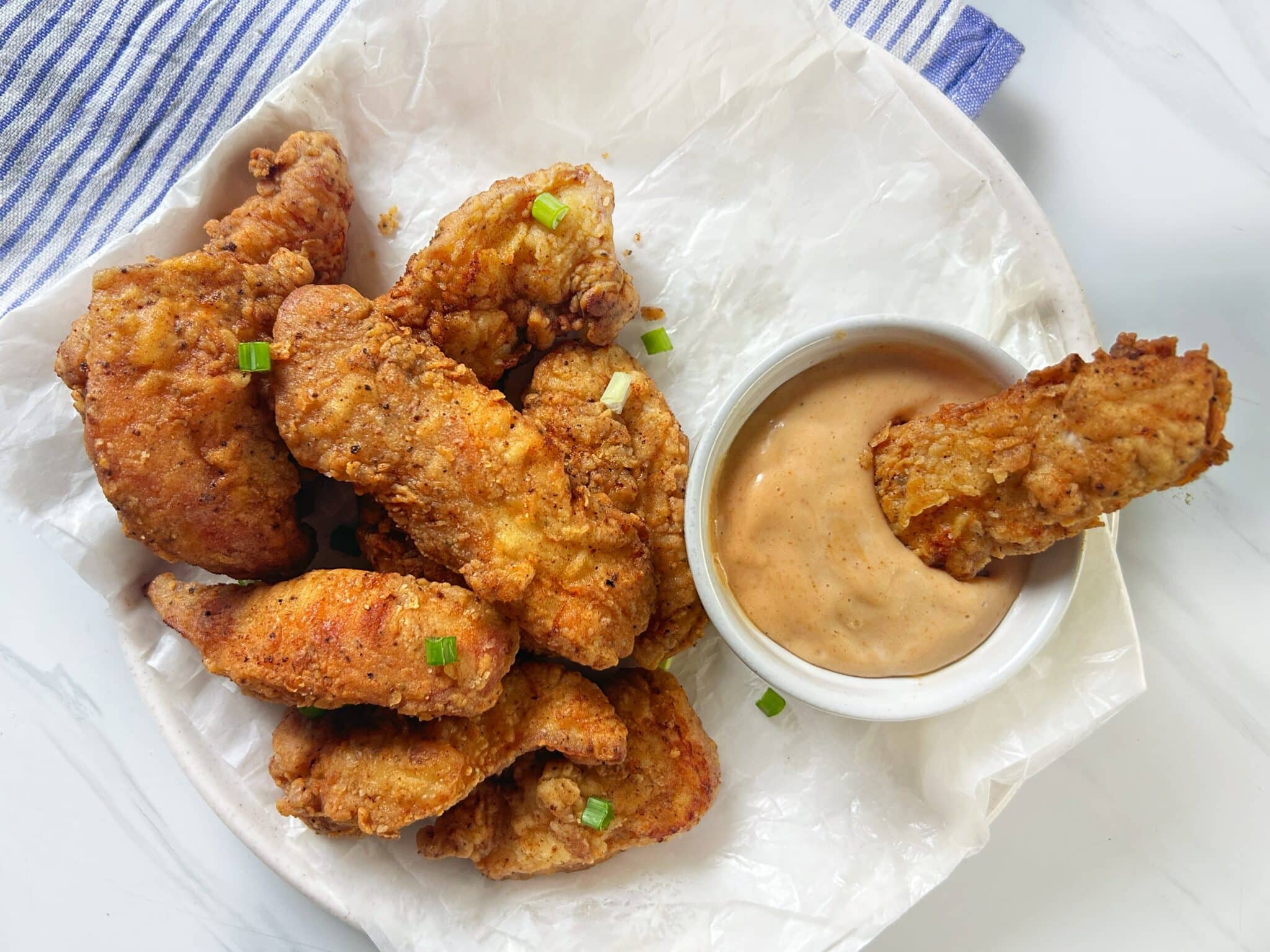 Served Cane’s chicken fingers with Cane’s dipping sauce Served Cane’s chicken fingers with Cane’s dipping sauce