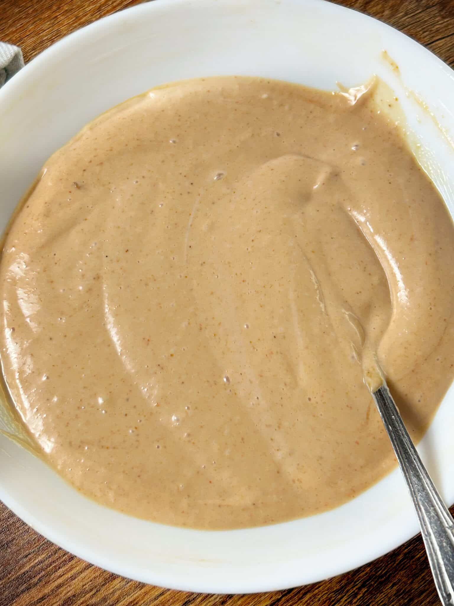 Prepared chicken fingers and sauce covered and refrigerated before serving Prepared chicken fingers and sauce covered and refrigerated before serving