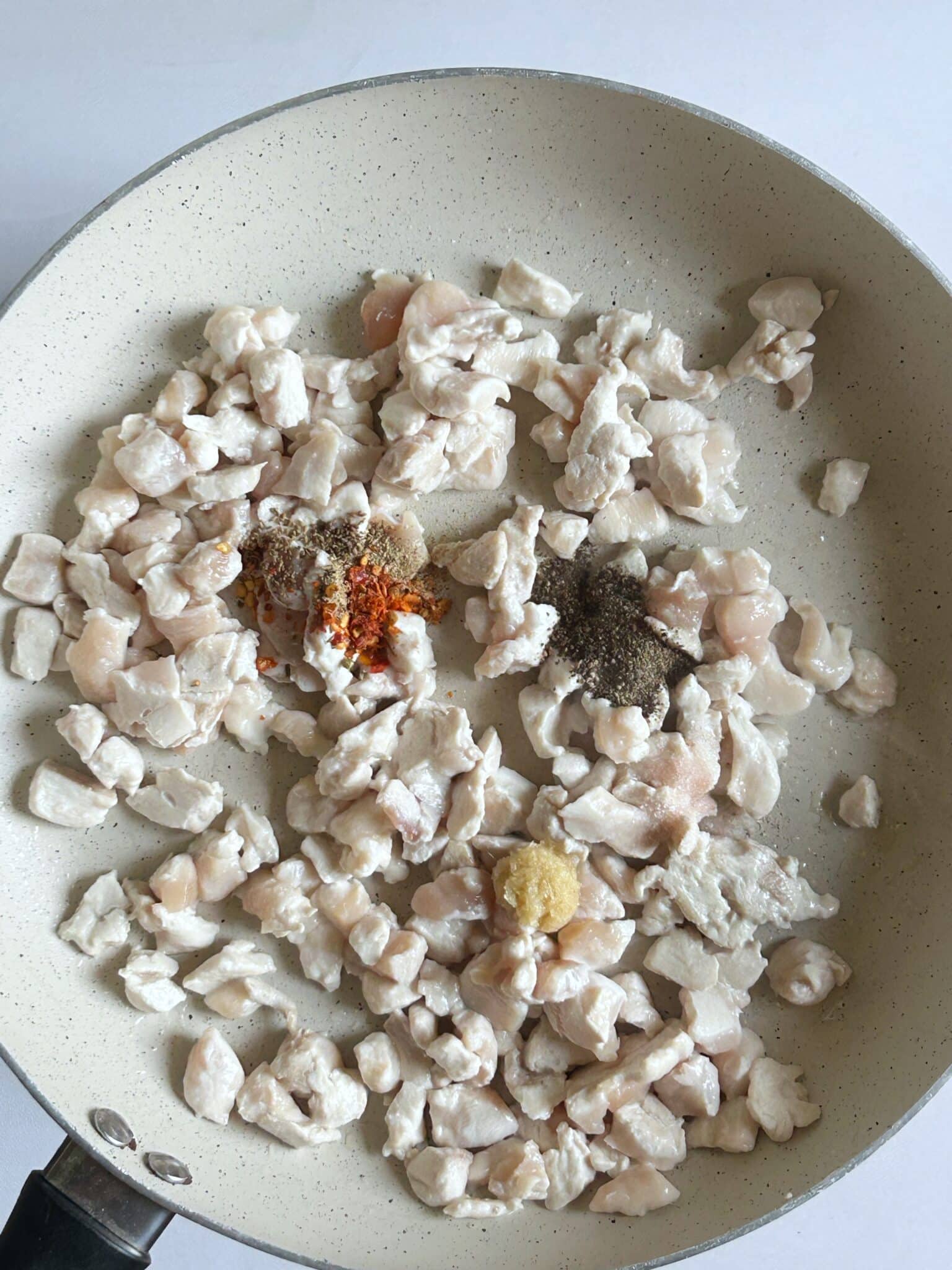 Spiced chicken cooking in pan for Chicken Malai Boti Samosa Spiced chicken cooking in pan for Chicken Malai Boti Samosa