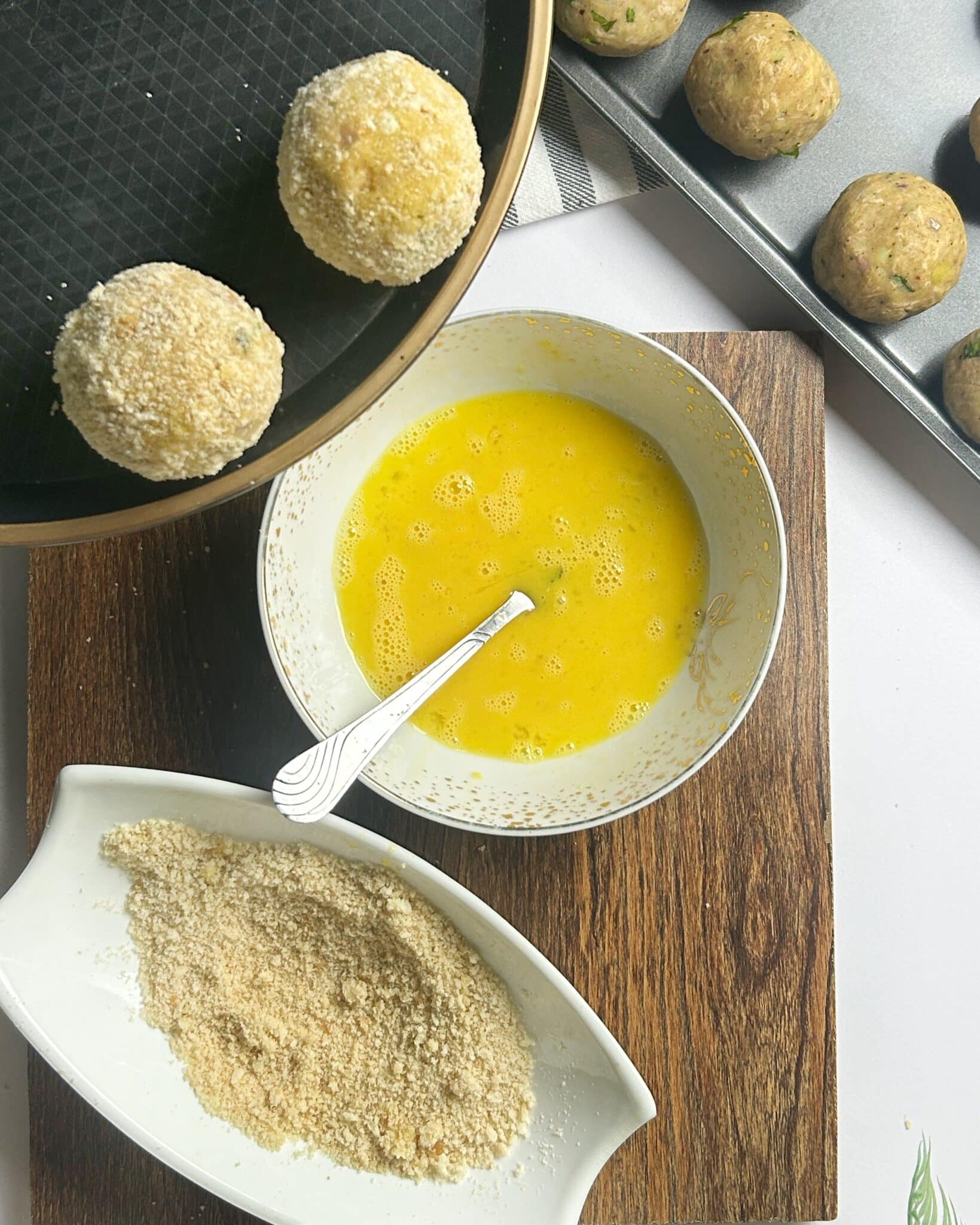Cheese balls dipped in egg and coated with breadcrumbs Cheese balls dipped in egg and coated with breadcrumbs