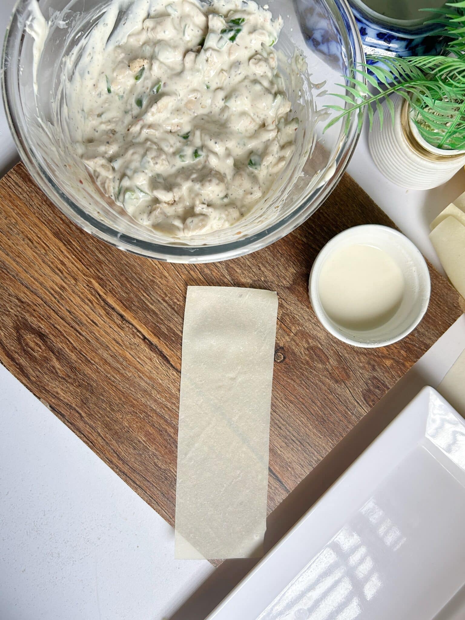 Filling Chicken Malai Boti mixture into samosa sheet Filling Chicken Malai Boti mixture into samosa sheet