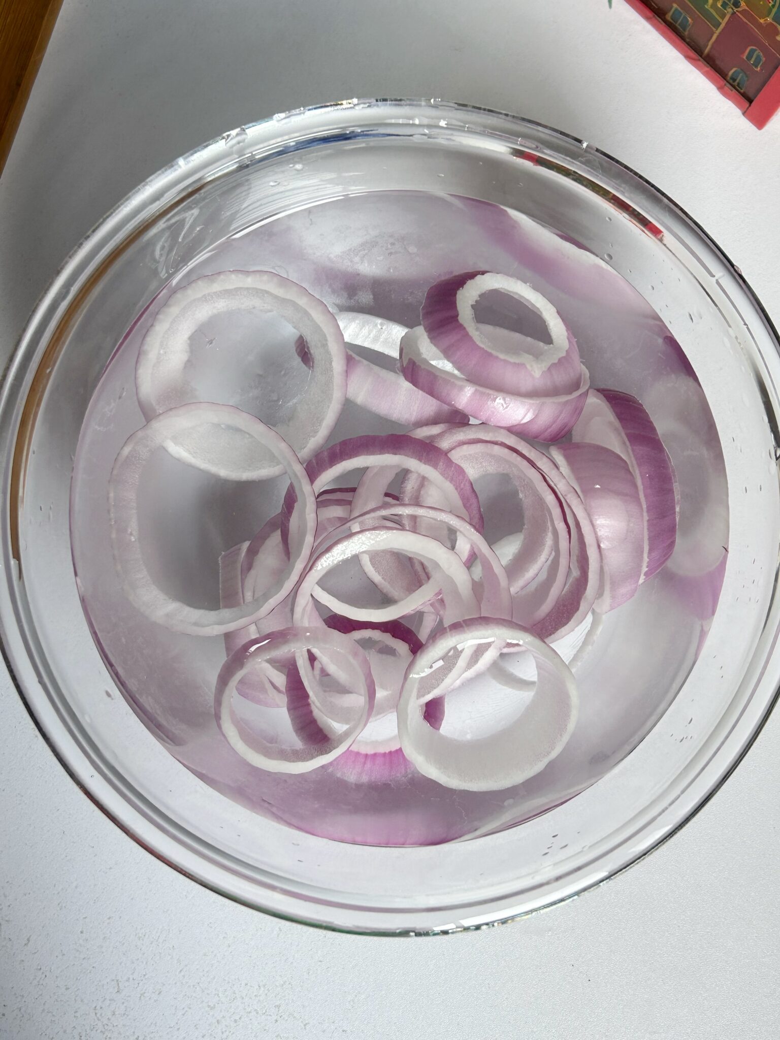 Onion rings soaking in cold water Onion rings soaking in cold water