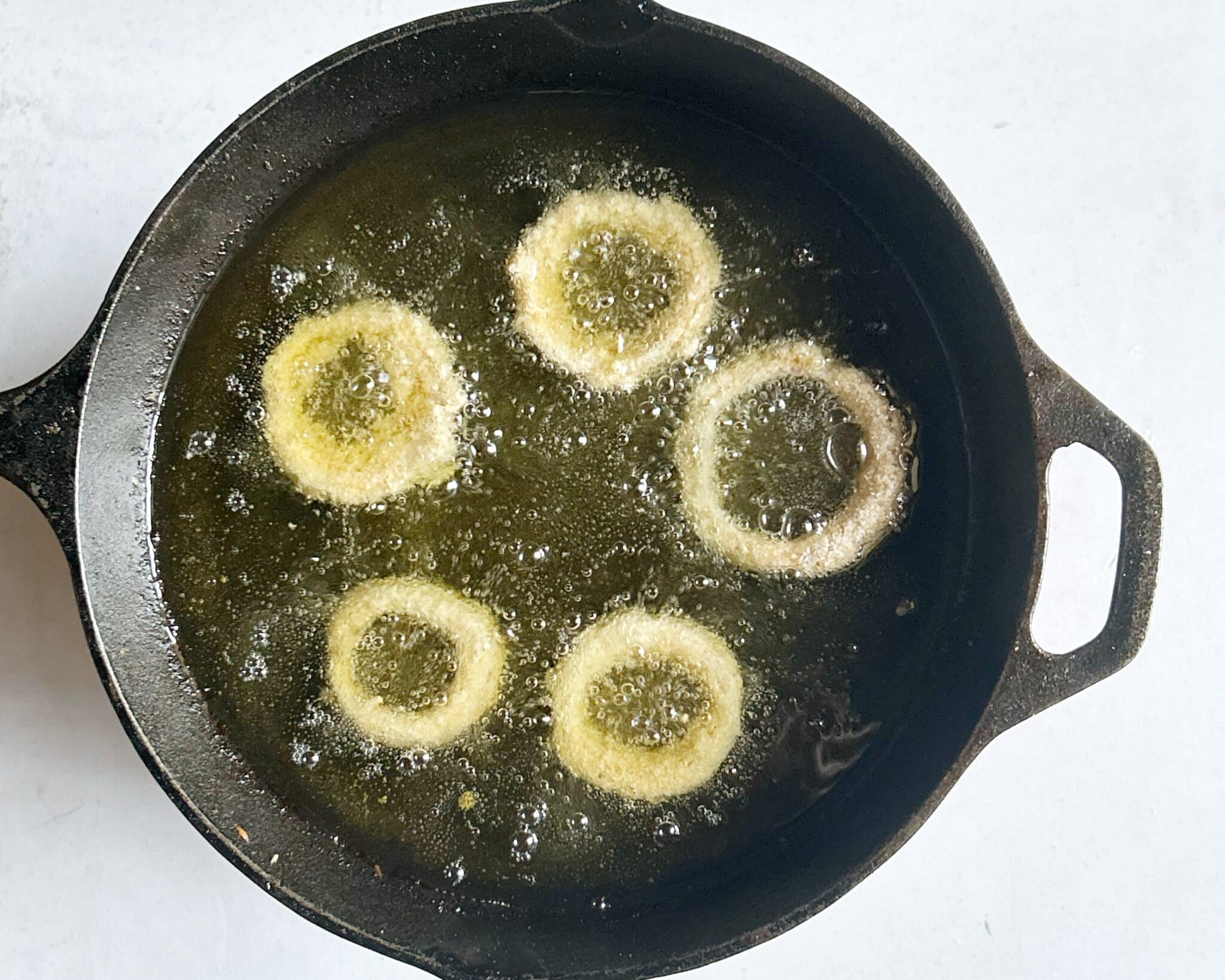 Frying onion rings until golden Frying onion rings until golden