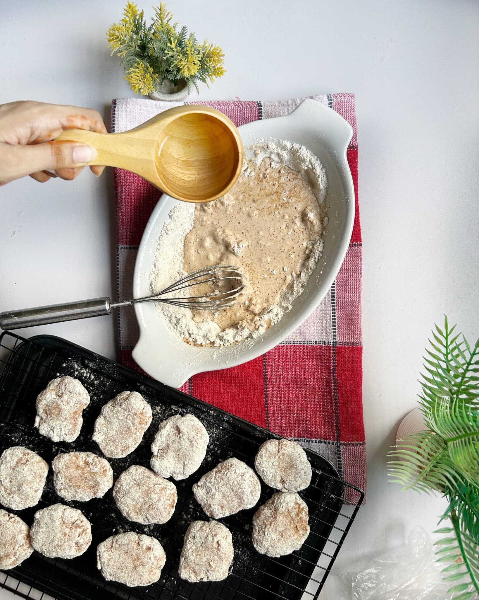 Preparing wet batter for crispy homemade chicken nuggets by mixing dry ingredients with water Preparing wet batter for crispy homemade chicken nuggets by mixing dry ingredients with water