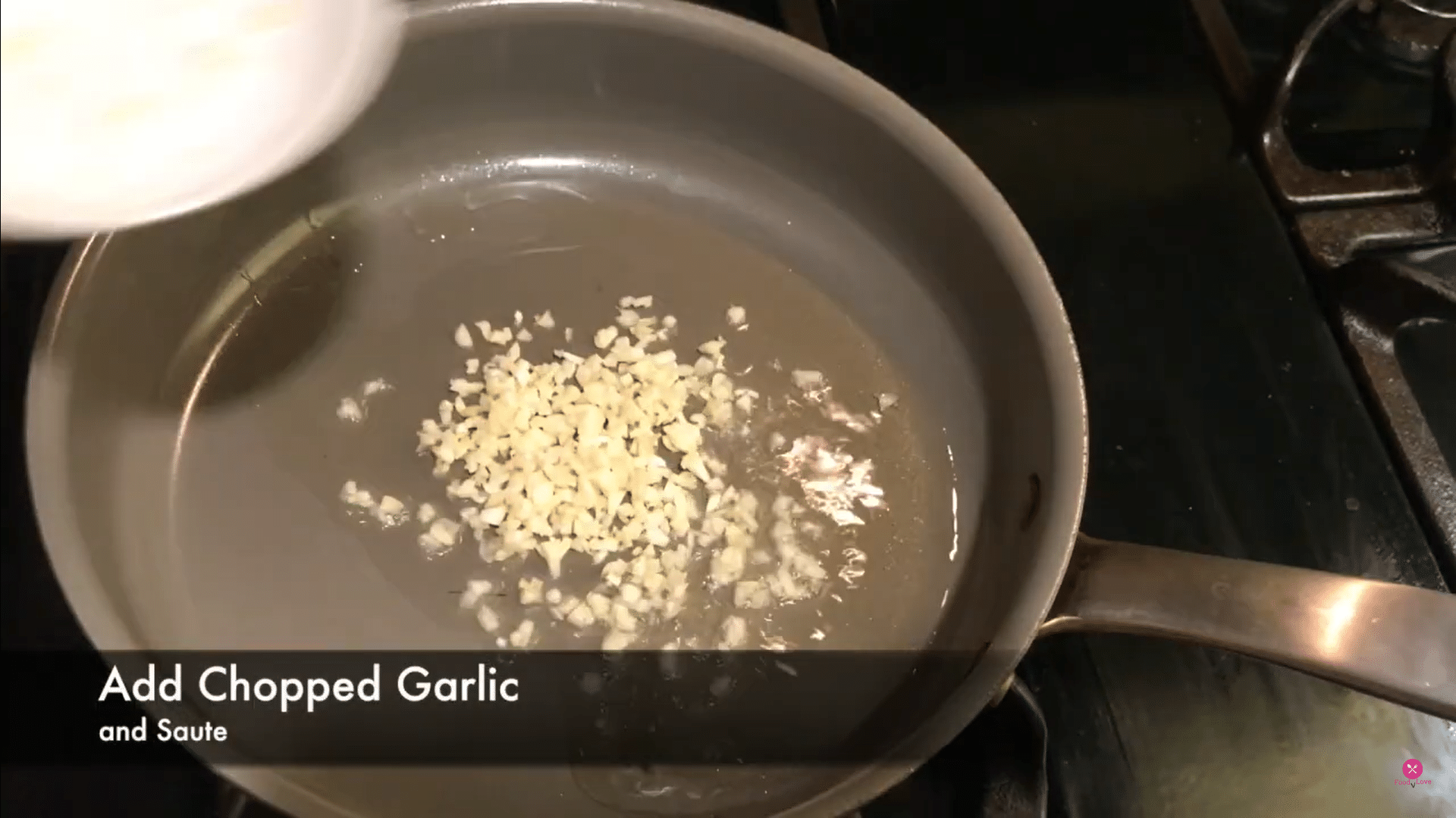 heat oil in a frying pan and add chopped garlic in it