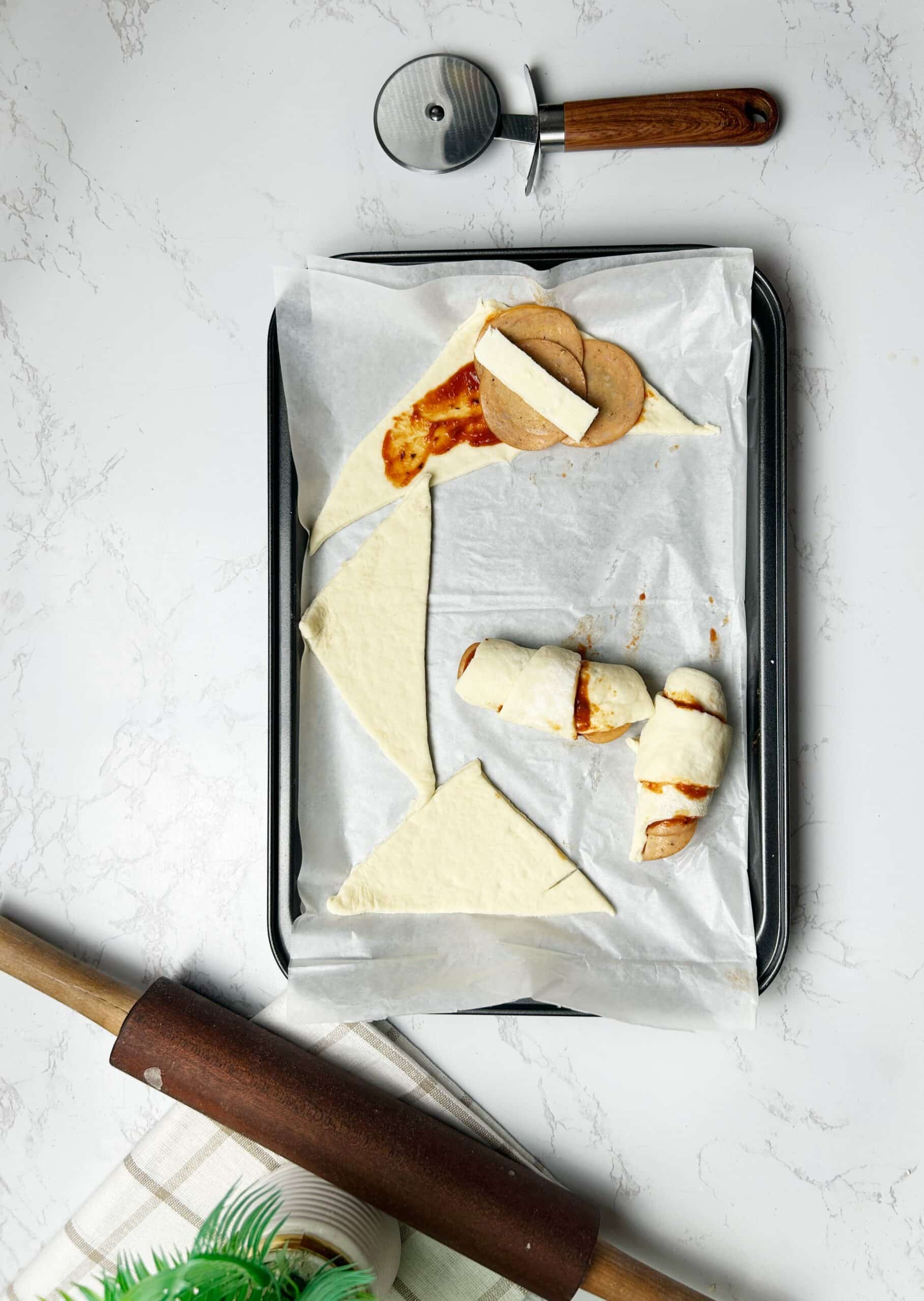 filling the pizza rolls with pepperoni and cheese