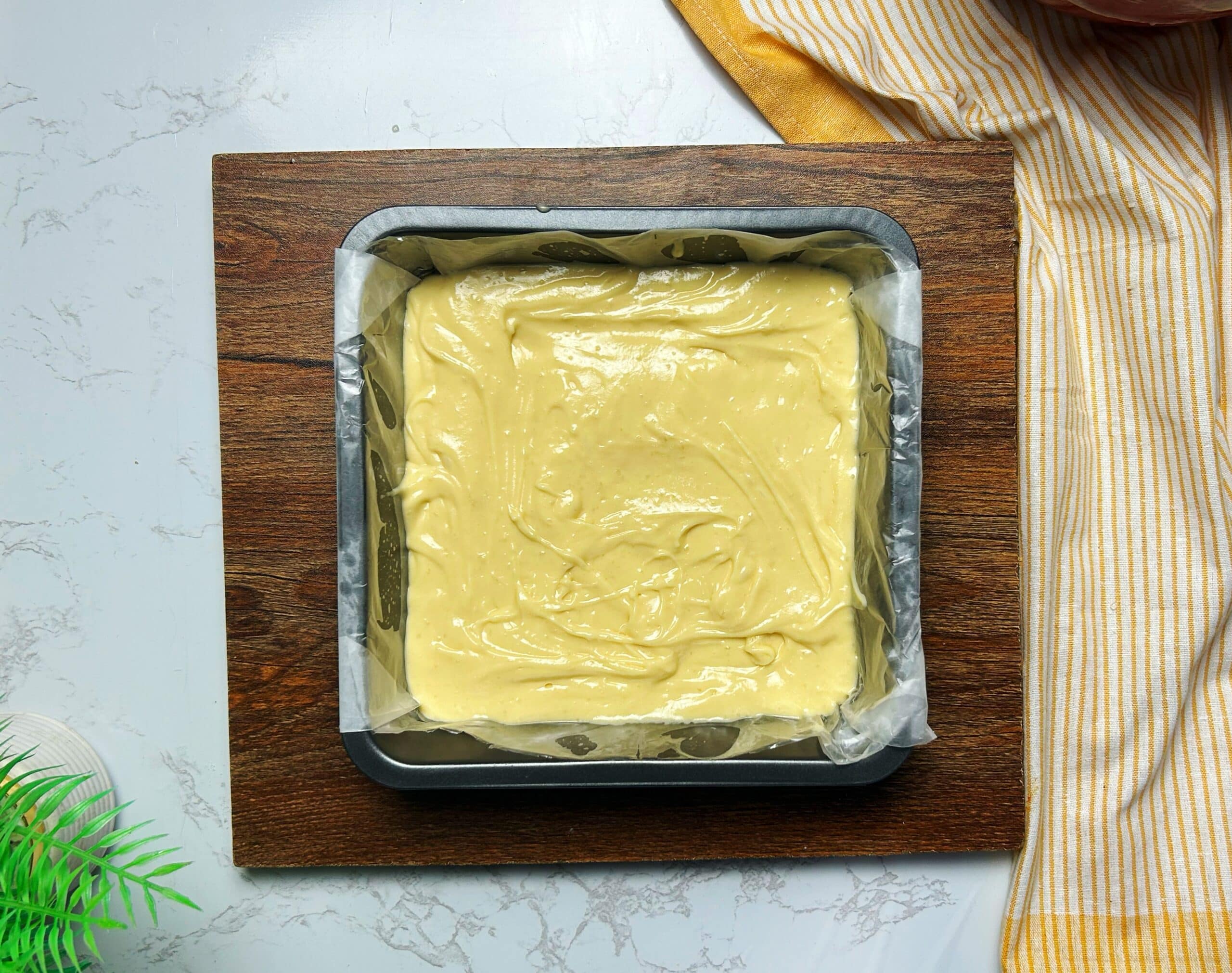 spreading cake batter in a pan