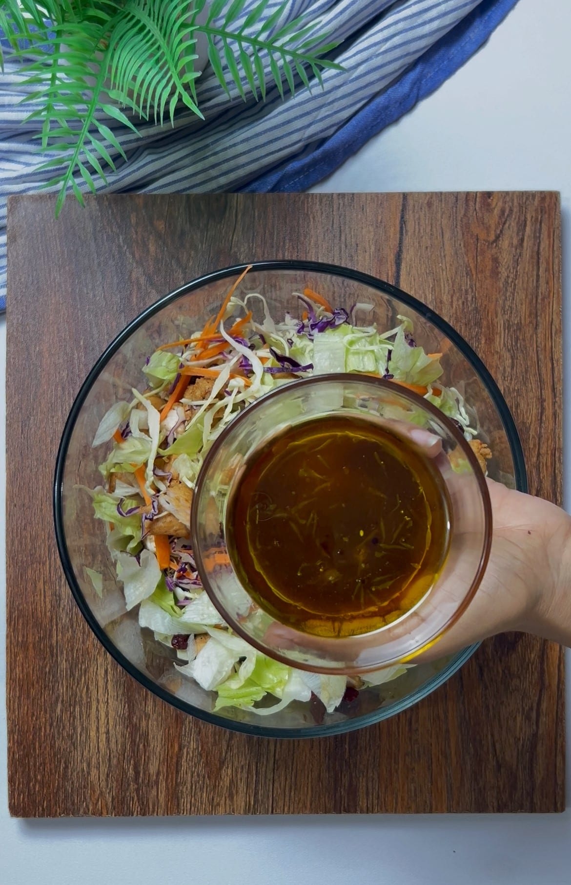 adding dressing in the bowl